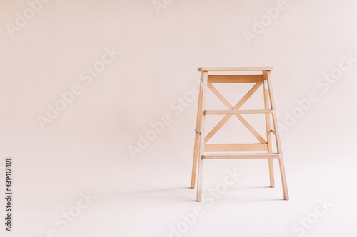 New wooden ladder on the white background. isolated stepladder. Space for text