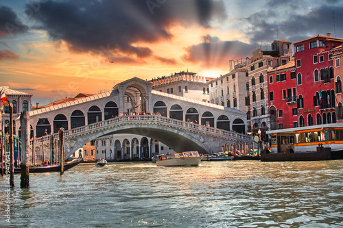 Rialto bridge in Venice with gondolas at sunset in Venice  © Emanuele