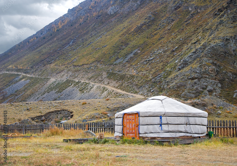 Traditional yurt on the background of high mountains, Altai