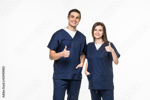 young friendly medical team in lab coat with thumbs up