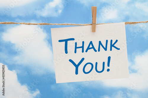 Thank you white greeting card over blue sky