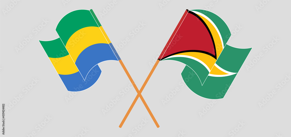 Crossed and waving flags of Gabon and Guyana Crossed and waving flags of Gabon and Guyana