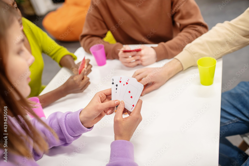 Girl looking at her cards and players Girl looking at her cards and players