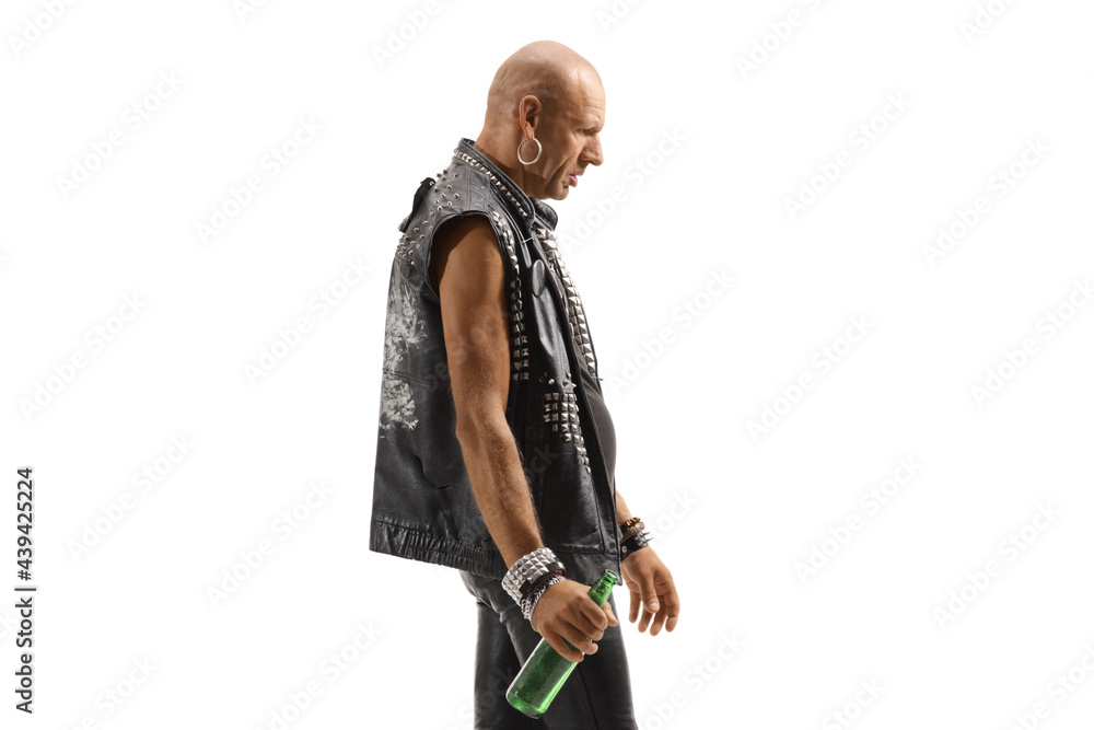 Punk walking and holding a bottle of beer Punk walking and holding a bottle of beer