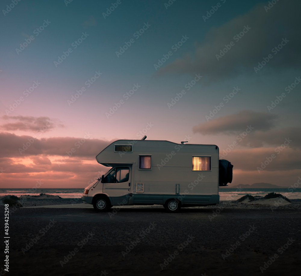 Mobile home with light at sunset Mobile home with light at sunset
