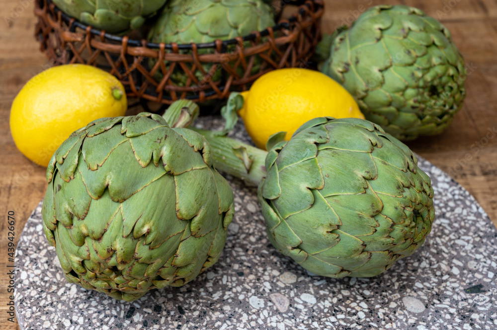 Fototapeta premium Fresh ripe green artichokes heads ready to cook