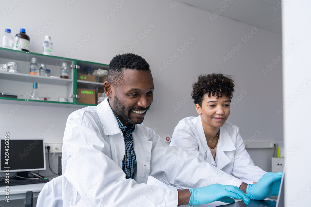 Two Smiling Researchers Two Smiling Researchers