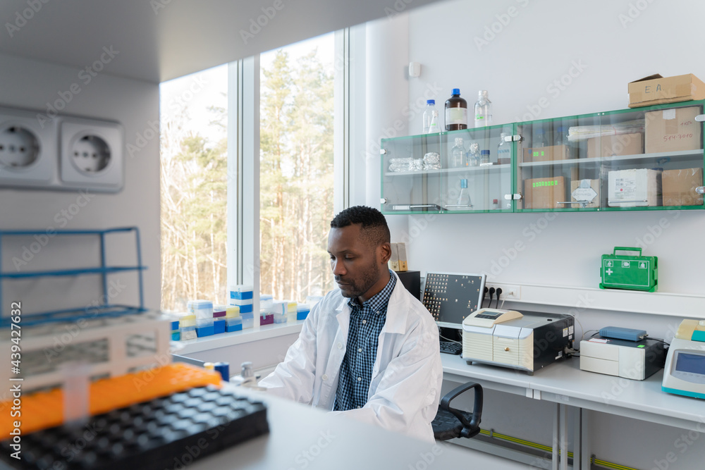 Man Researcher Working In Modern Lab Man Researcher Working In Modern Lab