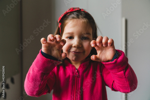 Tough Little Girl Showing her Claws photo