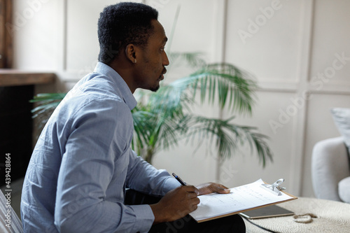 Serious psychotherapist providing mental help in office 
