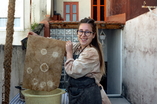 Happy woman showing the dyeing results photo