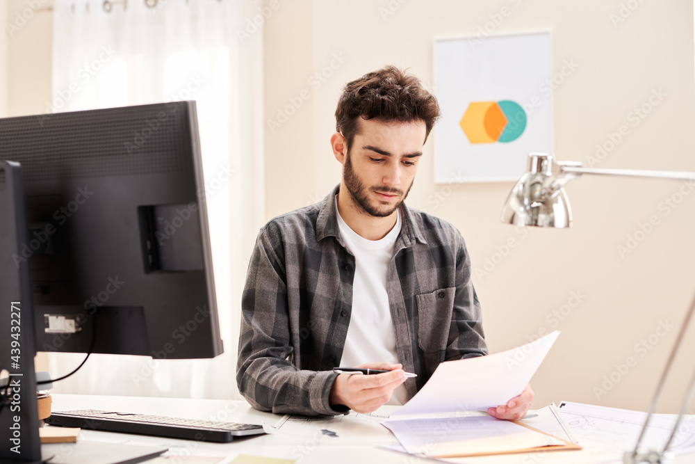 Young freelancer preparing to sign contract Young freelancer preparing to sign contract