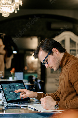 man watching the rate of cryptocurrencies