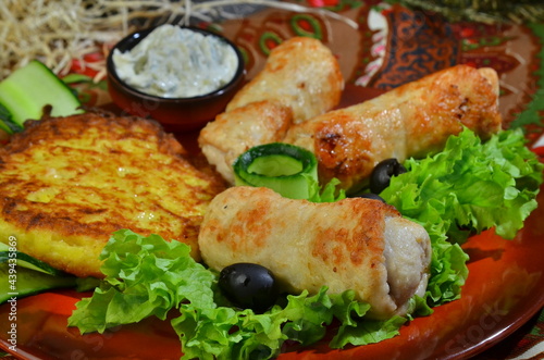 Fried meat cutlets with salad on dark plate for restaurant menu
