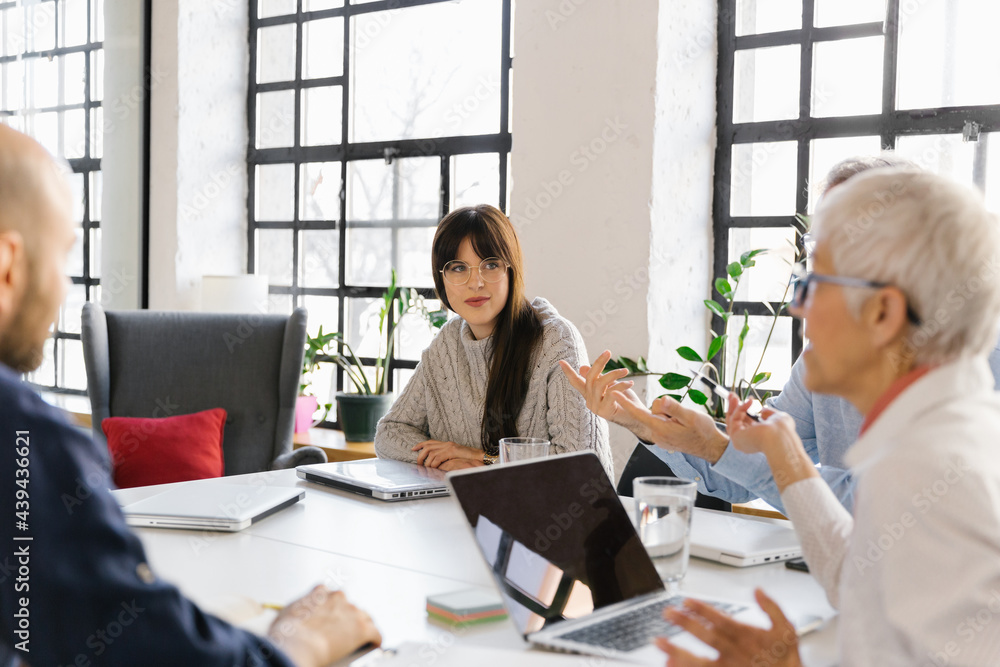 Businesspeople having a meeting in the office Businesspeople having a meeting in the office