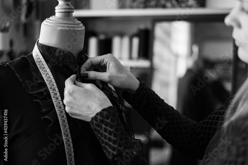 Woman fashion designer working in her sewing atelier