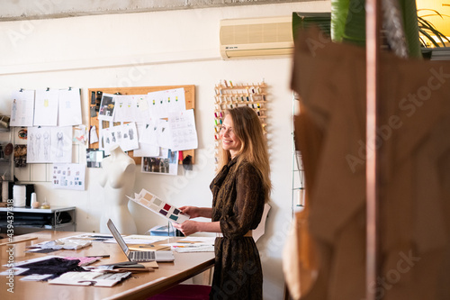 Woman fashion designer working in her sewing atelier
