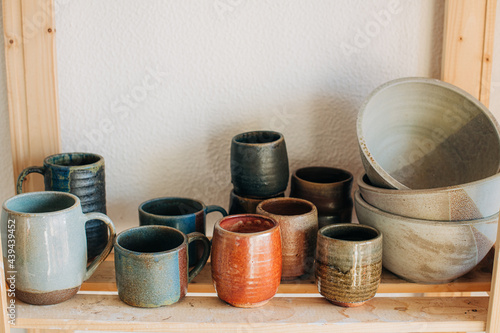 Handmade pottery on a shelf photo