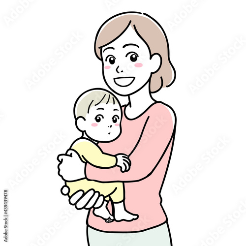 A smiling mother holding her baby in her arms
