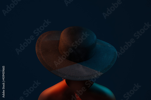 Portrait of a young Afro Woman with hat on dark blue background photo