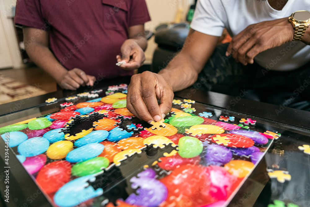 Father And Son Filling Holes In Puzzle Father And Son Filling Holes In Puzzle