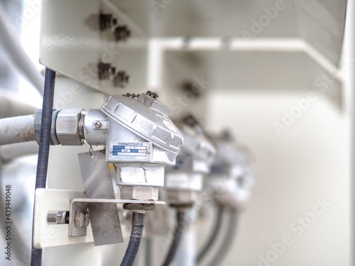 Temperature sensor for measuring instrument close up in industry zone at power plant.