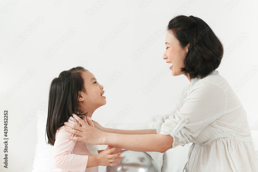 Happy loving family. Mother and her daughter child girl playing and hugging. Happy loving family. Mother and her daughter child girl playing and hugging.