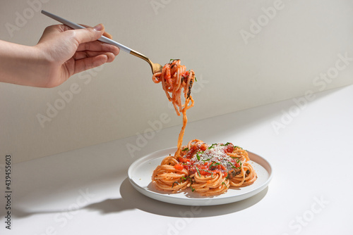 spaghetti with tomato sauce with fork photo