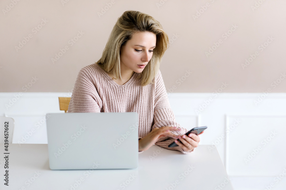 Woman browsing smartphone during work Woman browsing smartphone during work