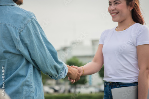 Two people shake hand friendship outdoor, Concept hand shake