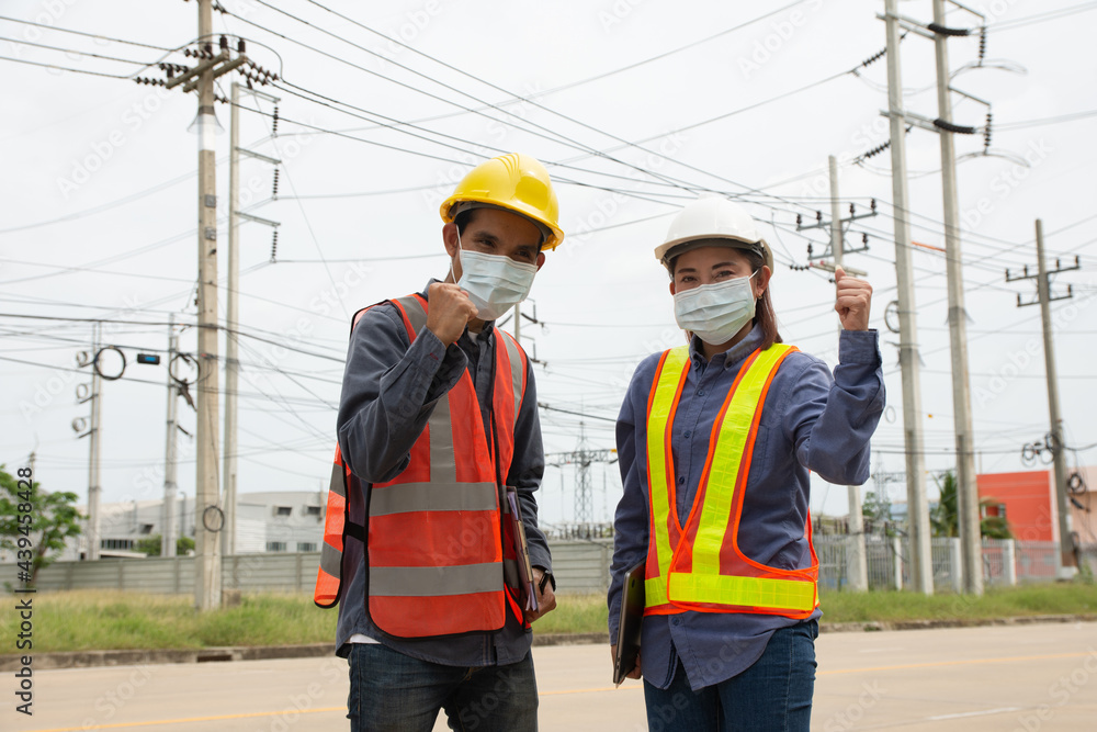 team of electrical engineers inspects the quality of the installation of high voltage poles team of electrical engineers inspects the quality of the installation of high voltage poles