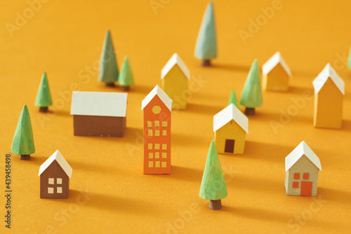 houses made of paper with the trees photo