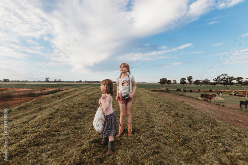 girl playing on silage stack photo