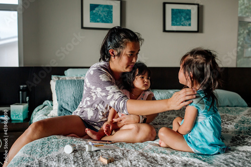 Deaf mom caring for sick daughters  photo