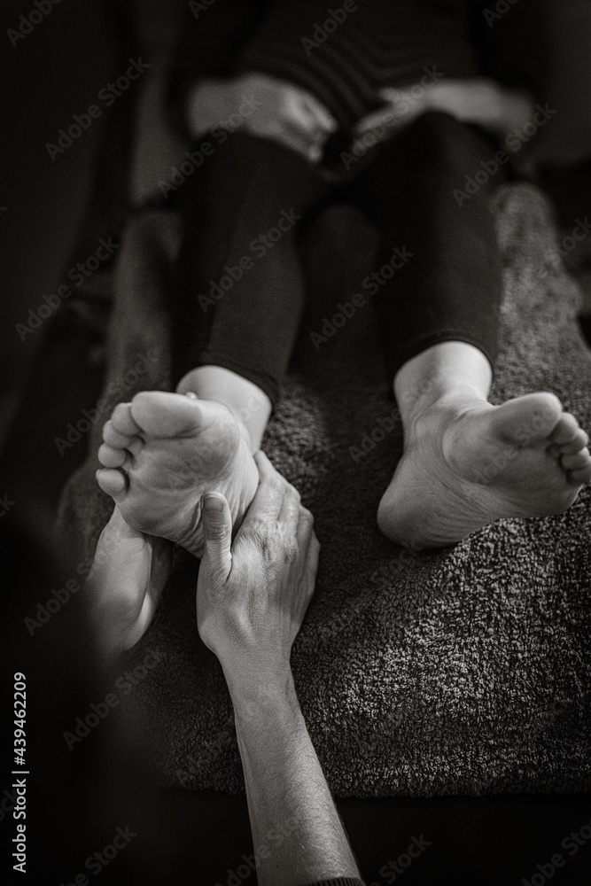 Close up of physiotherapist giving a feet massage Close up of physiotherapist giving a feet massage