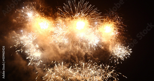 Golden Firework celebrate anniversary happy new year 2022, 4th of july holiday festival. Gold firework in the night time celebrate national holiday. Countdown to new year 2022 gold party time event