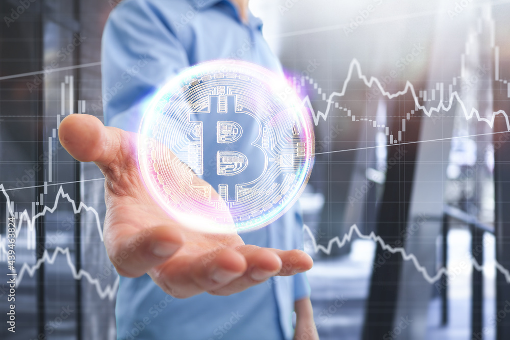 Businessman holds an illustration of bitcoin in his hand in the background of the illustration Businessman holds an illustration of bitcoin in his hand in the background of the illustration