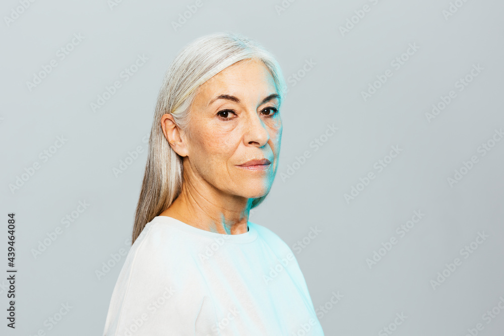 Modern senior female under blue light Modern senior female under blue light