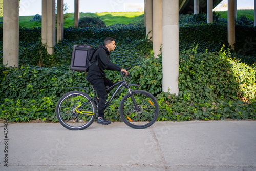 Courier With Bike Delivering Food.  photo