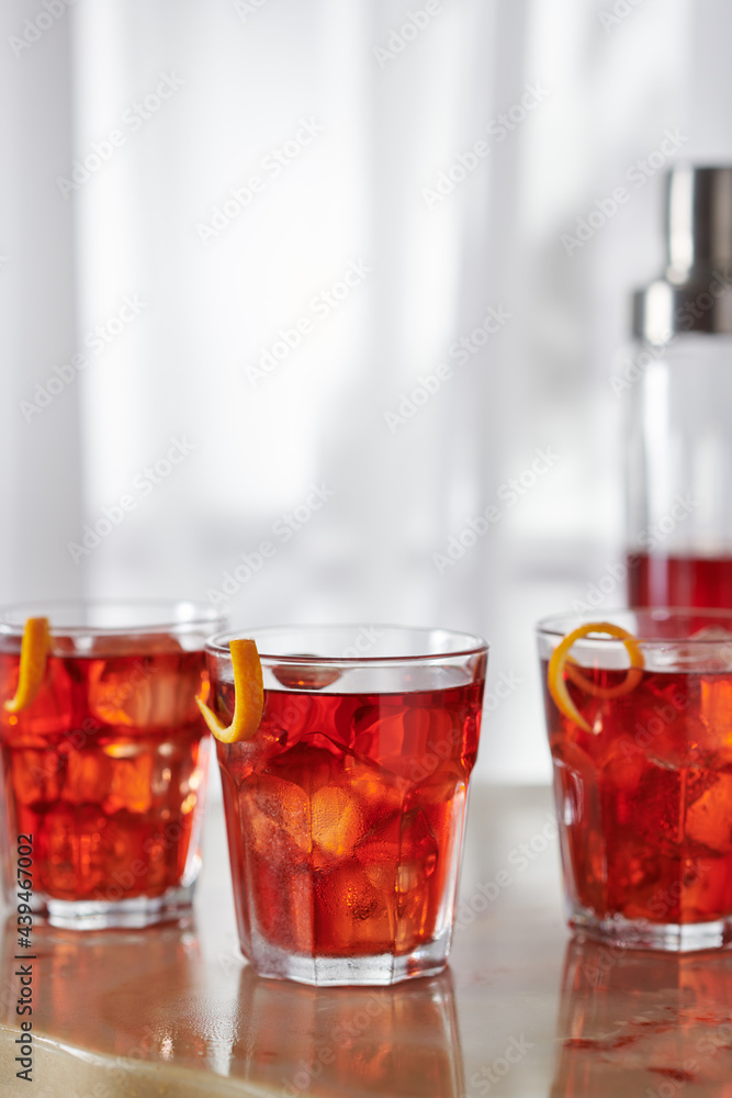 Three Boulevardier Cocktails with Orange Garnish Three Boulevardier Cocktails with Orange Garnish