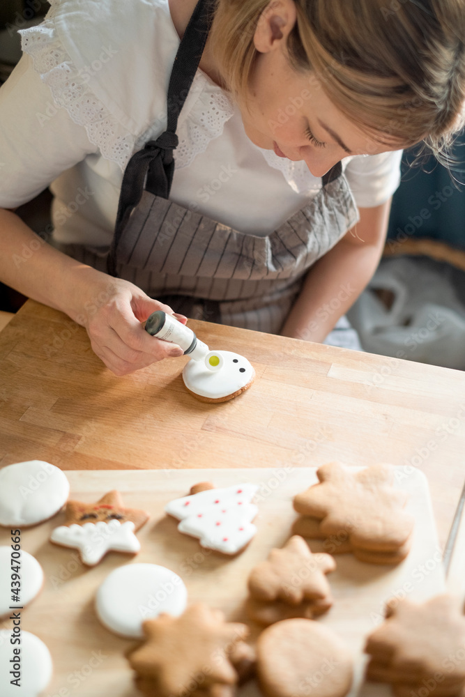 Decorating handmade Christmas cookies at home