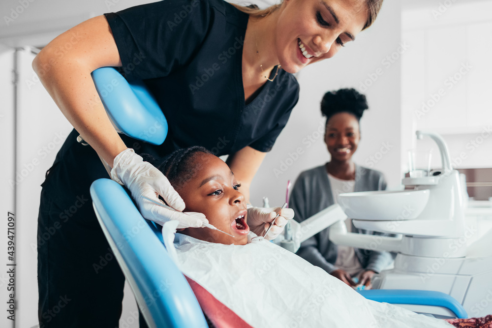 A Mother and a Daughter At a Dentist A Mother and a Daughter At a Dentist
