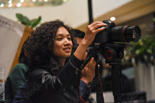 Camera woman filming event