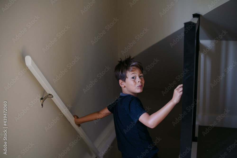Young boy inside home and bored Young boy inside home and bored