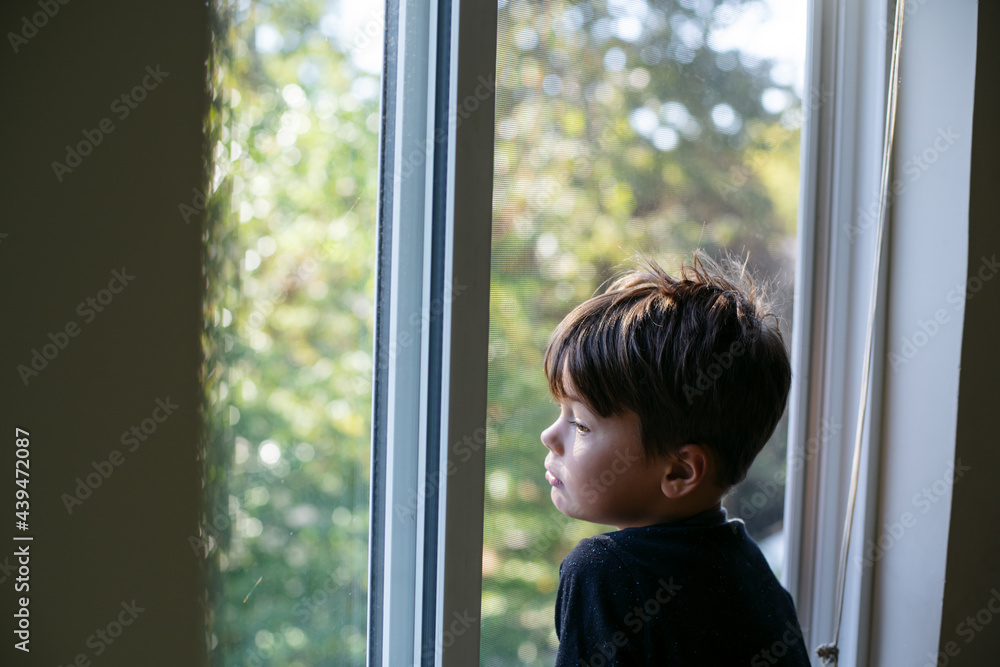 Young boy inside home and bored Young boy inside home and bored