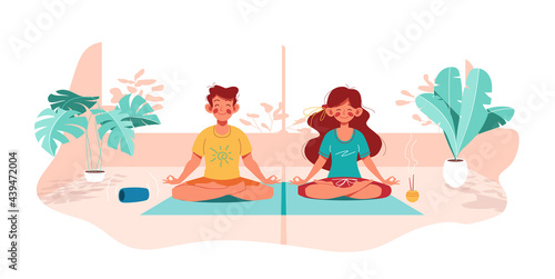 Fitness at home. Girl and boy. Yoga in lotus pose