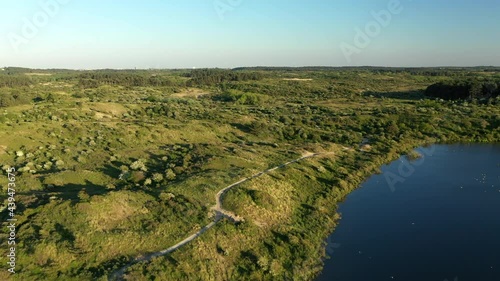 Beautiful Aerial footage of National Park Kennemerland with sunset in The Netherlands photo