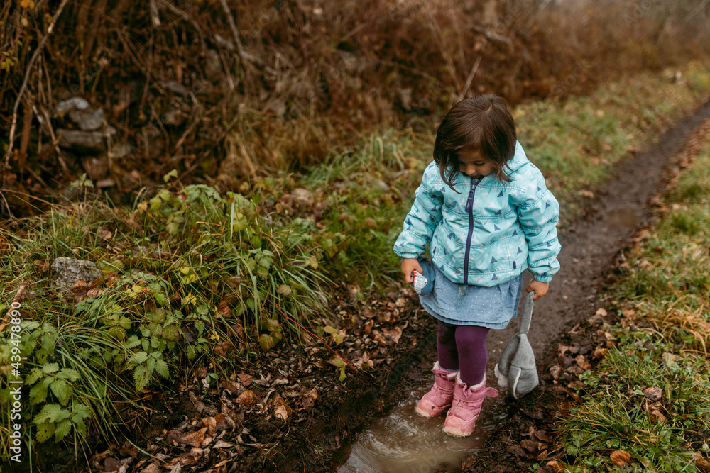 little girl walking in country road little girl walking in country road
