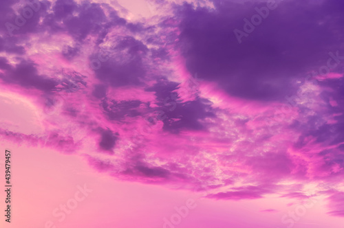 Photo dramatic colored evening sky with pink blue clouds. © Kamila