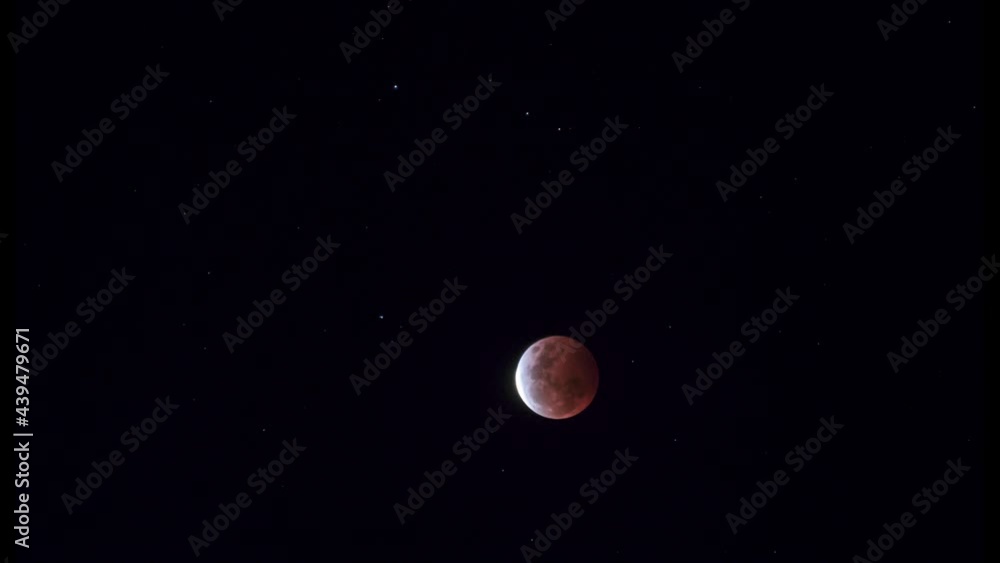 Beautiful red full moon lunar eclipse time lapse, night sky of moon and stars Beautiful red full moon lunar eclipse time lapse, night sky of moon and stars